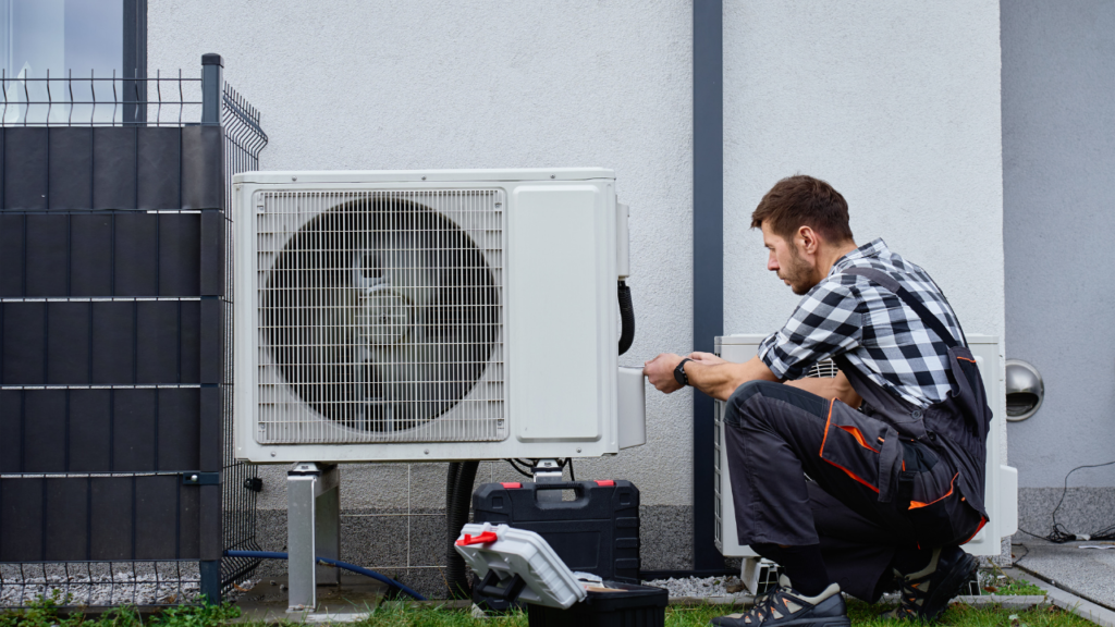 Technician completing final HVAC system check
